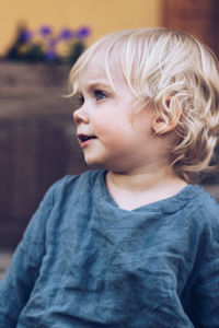 Cute baby girl looking away