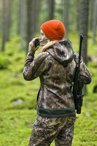 Woman hunting in forest