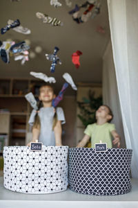 Full length of woman with toy blocks on table