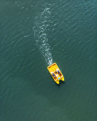 High angle view of people boating on sea