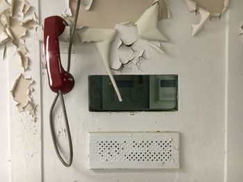 Low angle view of wall and bridge against graffiti on walls