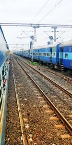 Train on railroad track against sky