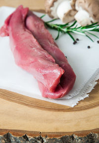 Close-up of meat on cutting board