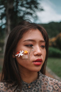 Portrait of a beautiful young woman in the garden