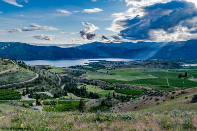 Scenic view of mountains against cloudy sky