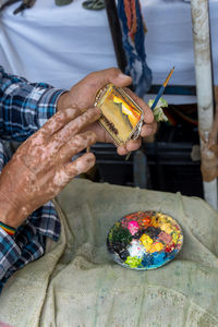 Midsection of man preparing food