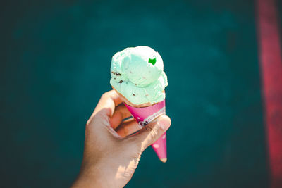 Close-up of hand holding ice cream