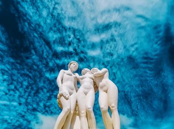 Low angle view of statue against swimming pool