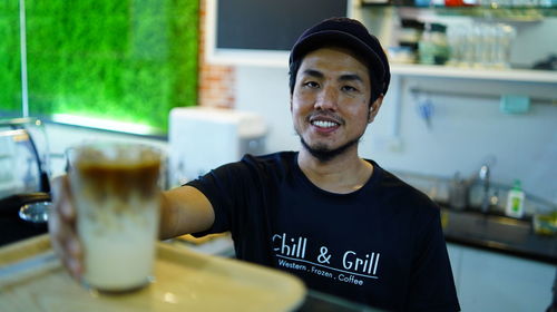 Portrait of young man using mobile phone