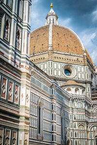 Low angle view of ornate building against sky