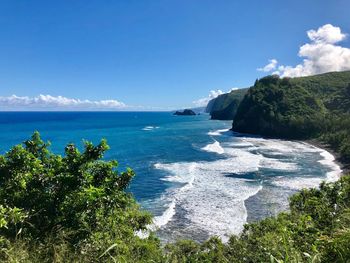 Scenic view of sea against blue sky