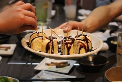 Close-up of hand holding ice cream