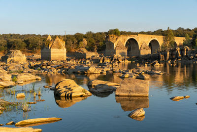 Destroyed abandoned ajuda bridge crossing the guadiana river between spain and portugal