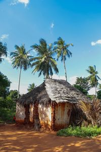 Run down traditional mud hut with thatch roof in rural kenya. 