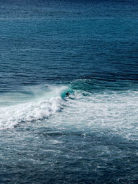 Person surfing in sea