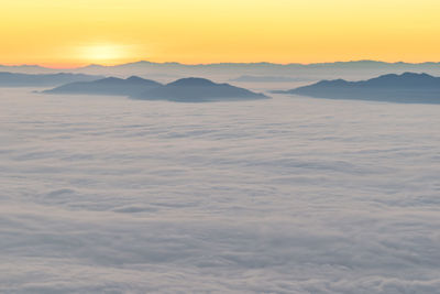 Scenic view of desert against sky during sunset