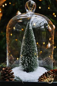 Close-up of illuminated christmas tree on table