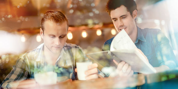 Portrait of man looking at restaurant