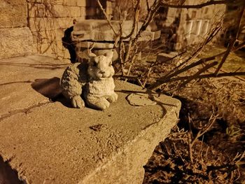 Close-up of angel statue against rock
