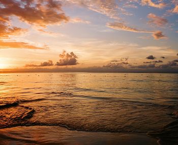 Scenic view of sea against dramatic sky