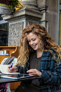 Young woman using tablet