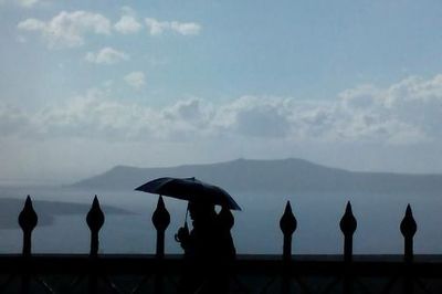 View of mountain range against cloudy sky