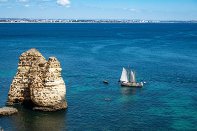 Sailboat on sea against sky