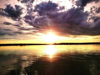 Scenic view of lake against sky during sunset