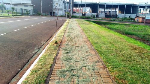 Railroad tracks in city against sky