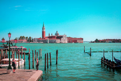 View of wooden post in canal