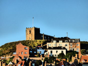 Low angle view of building against clear blue sky