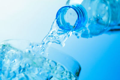 Close-up of bubbles against blue background