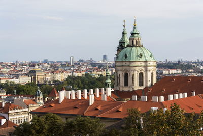 Buildings in city against sky