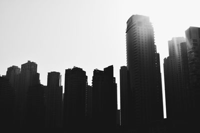 Skyscrapers in city against clear sky