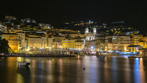 Illuminated buildings in city at night