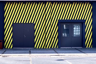 Closed door of building with diagonal stripes 