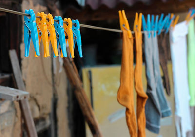 Close-up of socks hanging on clothesline