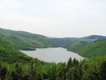Scenic view of landscape and mountains against sky