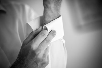 Close-up of young woman holding hands