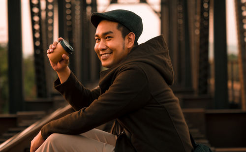 Portrait of young man using mobile phone