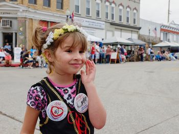 Smiling girl standing outdoors