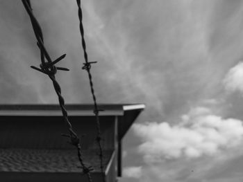 Low angle view of windmill against sky