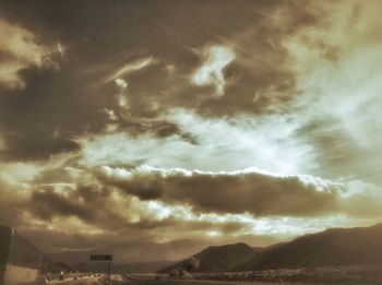 Scenic view of landscape against cloudy sky