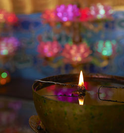 Close-up of illuminated lamp against blurred background