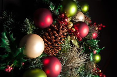 Close-up of decoration on christmas tree at night