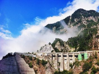 Low angle view of built structure against blue sky