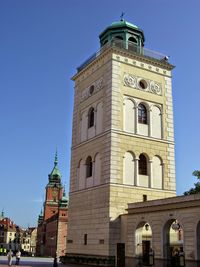 Low angle view of bell tower against blue sky