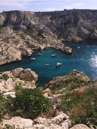 High angle view of rocks by sea