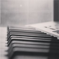 Close-up of piano keys on table