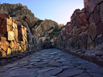 Rock formations on mountain against sky